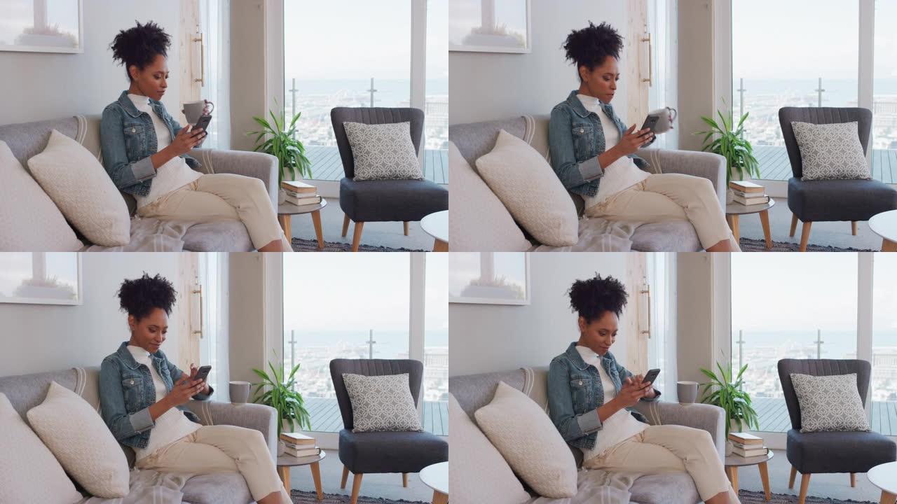 快乐的年轻女子使用智能手机浏览在线阅读社交媒体信息享受舒适的生活方式在家沙发上喝咖啡放松