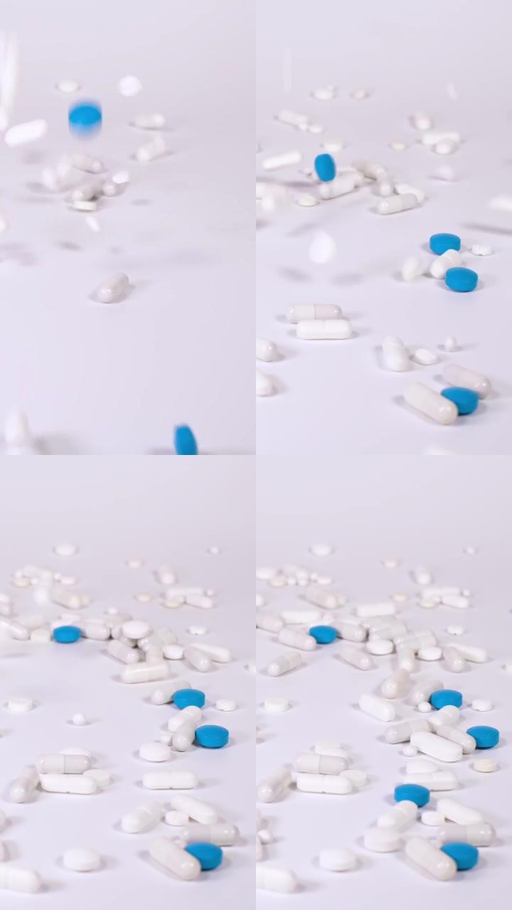 白色和蓝色的药片，药片和胶囊纷纷落下