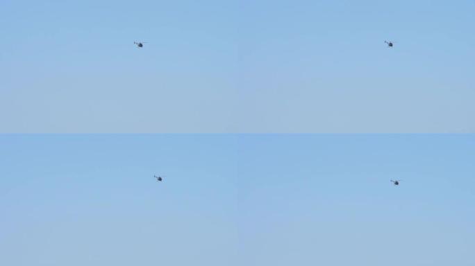 小型直升机在蓝天上飞行没有云背景