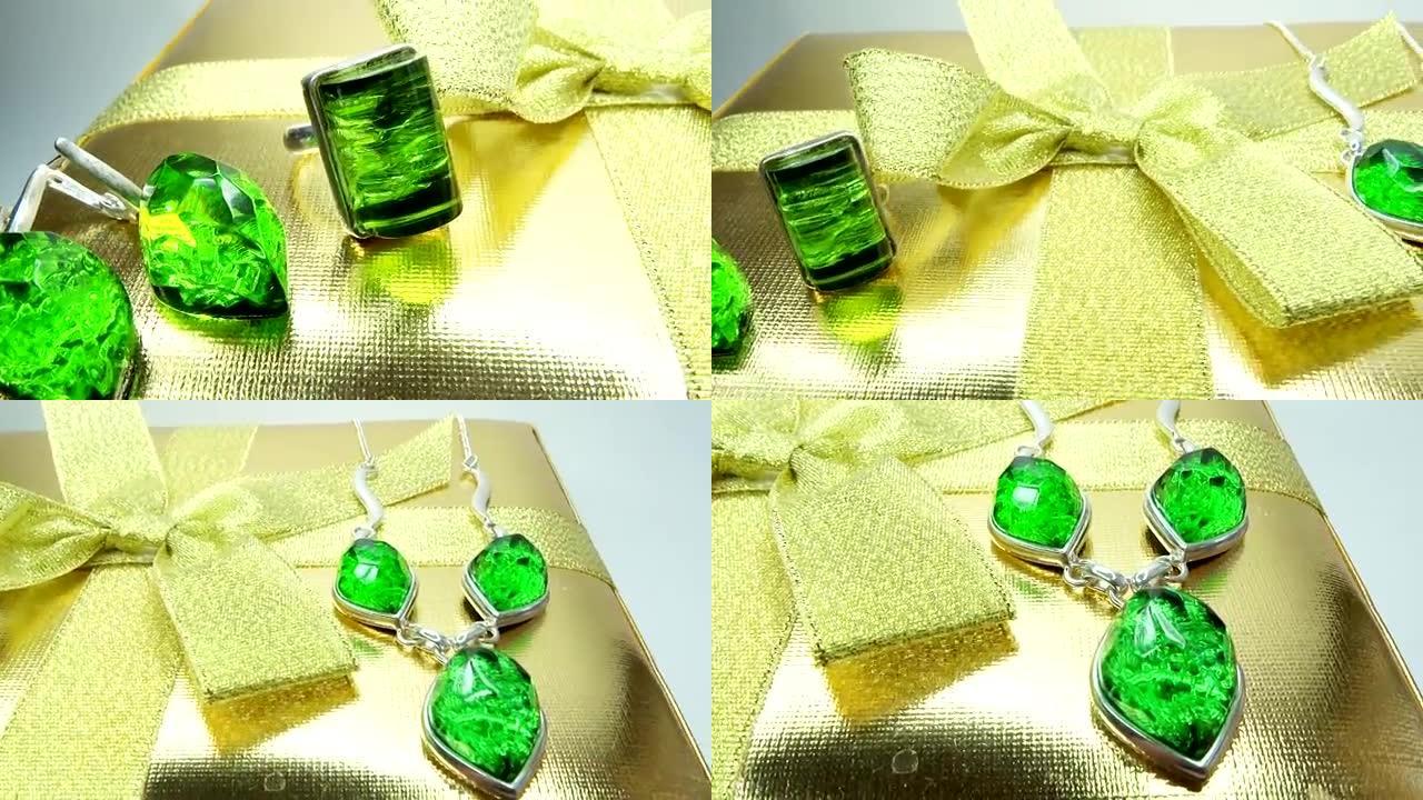 珠宝祖母绿戒指和金盒耳环