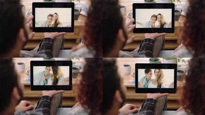 特写情侣使用数字平板电脑与朋友视频聊天度假观看移动设备屏幕享受连接在家放松