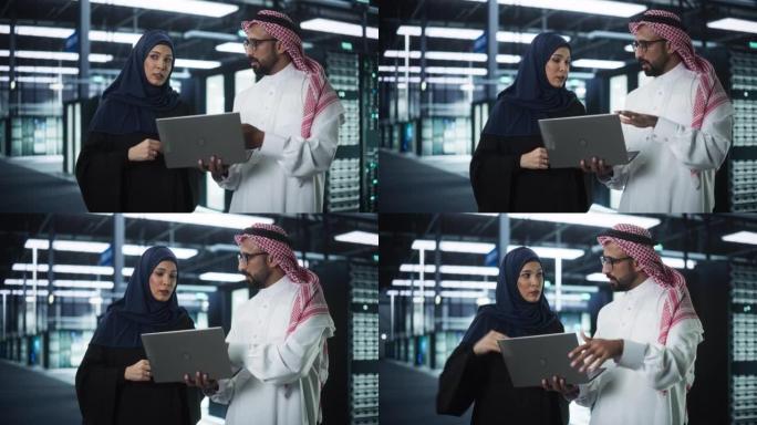 中东网络工程师和网络安全专家在服务器设施中工作。穆斯林男女经理交谈，用笔记本电脑进行系统维护检查