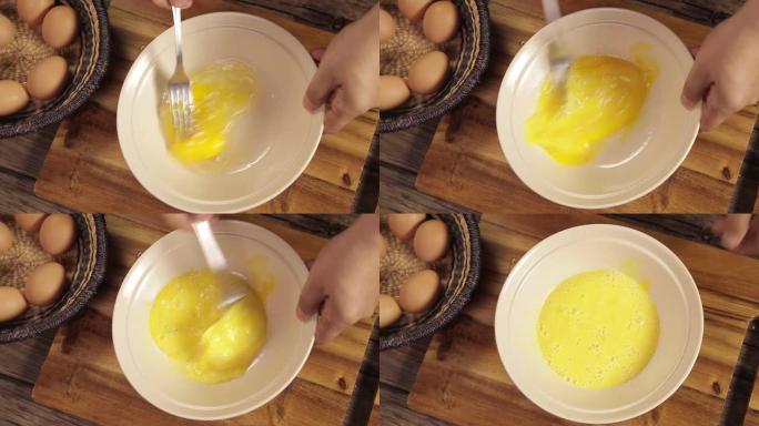 鸡蛋-在白色碗中混合2个棕色鸡蛋-顶角