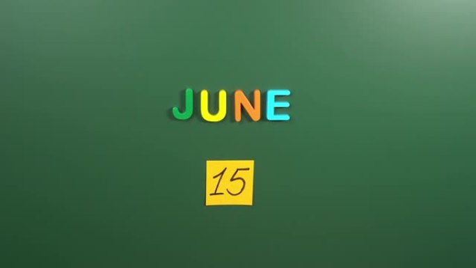 6月15日日历日用手在学校董事会上贴一张贴纸。15 6月日期。6月的第十五天。第15个日期编号。15