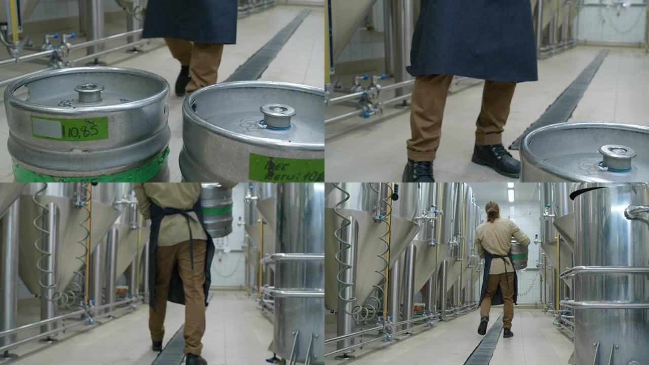 员工在啤酒厂携带完整的啤酒桶