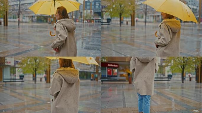 SLO MO年轻女子在雨天在城市开伞