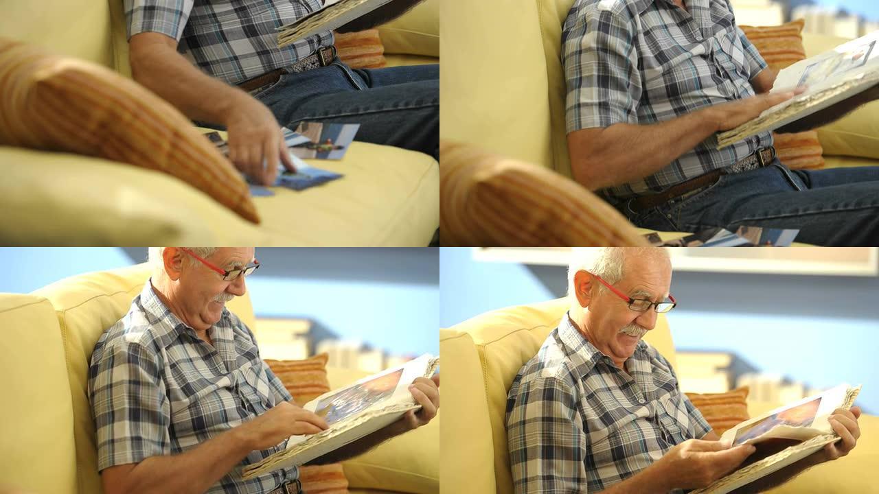 祖父看着他孙子的照片; 高清: 照片JPEG。