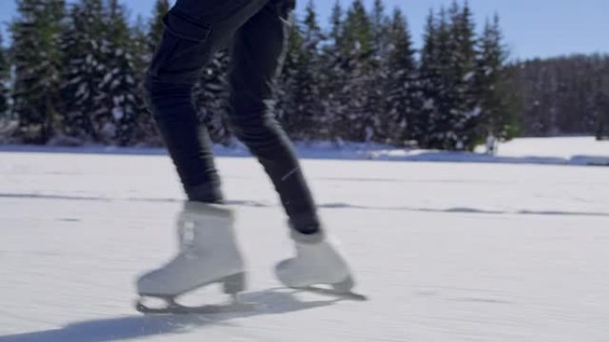 TS女孩的腿在阳光下的湖上滑冰