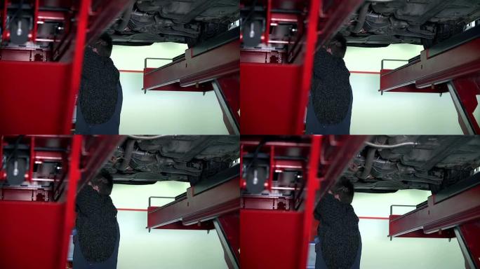 高清慢: 汽车修理工在车下工作