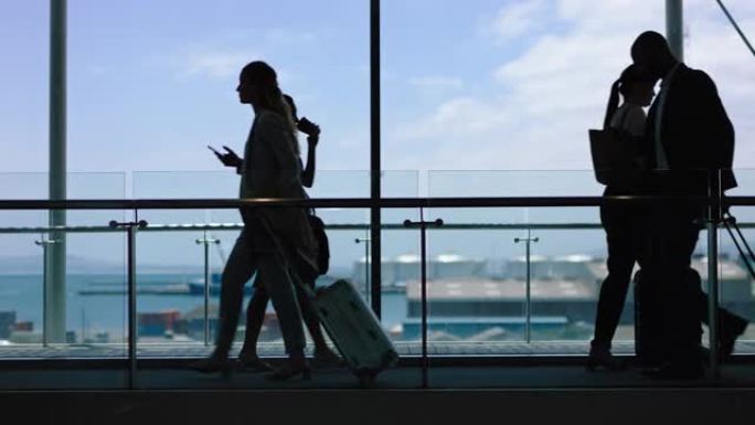 繁忙机场的商务人士拉着拉杆袋，在国际候机楼游客中旅行，在大堂散步，看到港口4k镜头