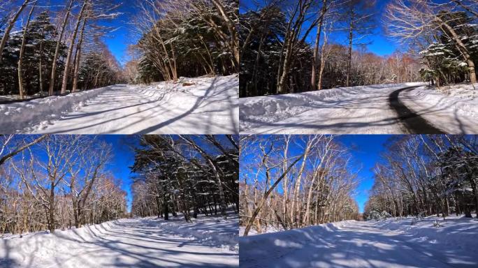 在冬季山区积雪覆盖的道路上行驶