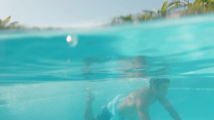迷人的亚洲男子在豪华酒店度假村游泳池游泳，享受在凉爽的水中游泳，在旅游假期4k放松美丽的夏日