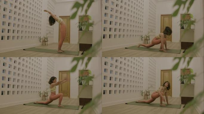活跃的亚洲女性从办公室回家后在家做轻松的瑜伽。