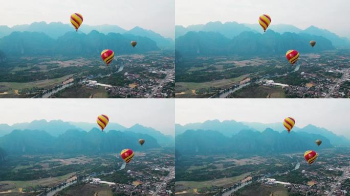 山谷上方红色热气球的鸟瞰图