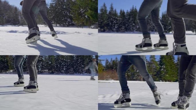 TS两人的腿在阳光下的冰冻湖上滑冰