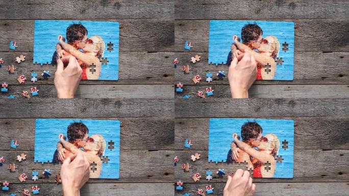 拼图与一对接吻夫妇在木制背景上的照片。情人节礼物创意。