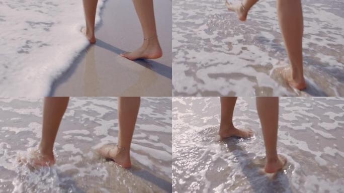 近距离女子脚赤脚走在海滩上享受海浪轻轻飞溅暑假女游客