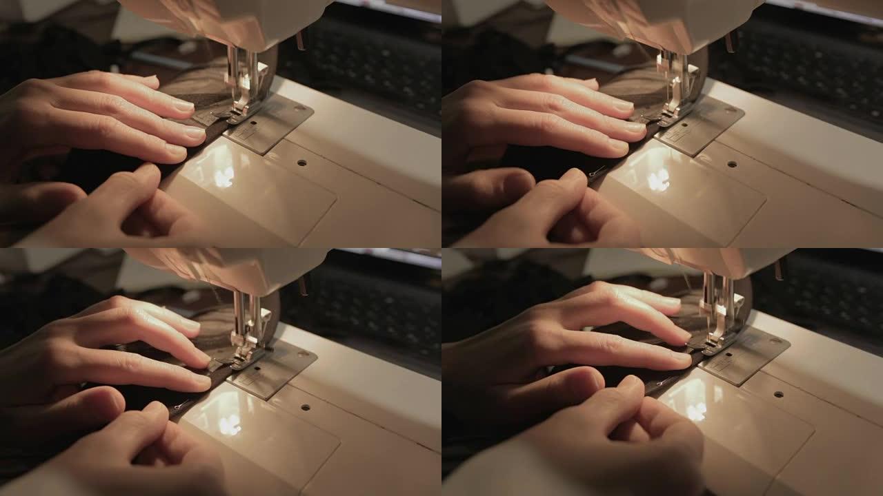 女性手在缝纫机上工作，在家里特写，做内衣