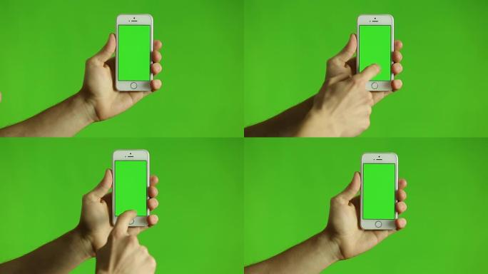 手指指向带有绿色色度的智能手机