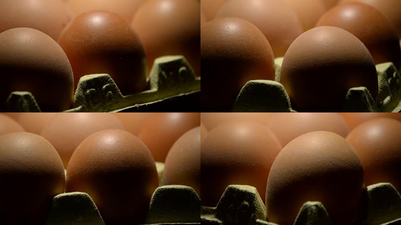 黑色背景下旋转的棕色鸡蛋