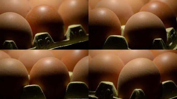 黑色背景下旋转的棕色鸡蛋