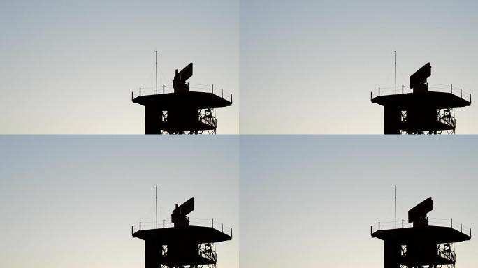 日落时机场电信塔中的雷达旋转