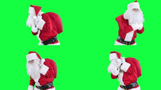 带礼品袋色度键的圣诞老人 (绿屏)
