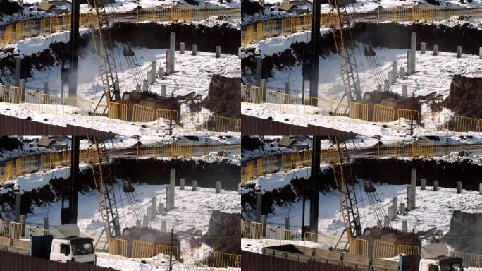 土方工程-将混凝土桩堵塞到地下。锤子的声音。地下的基坑