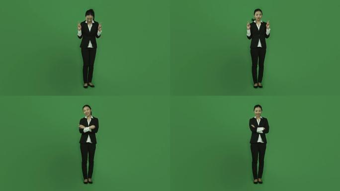 亚洲女商人孤立绿屏绿色背景手指交叉