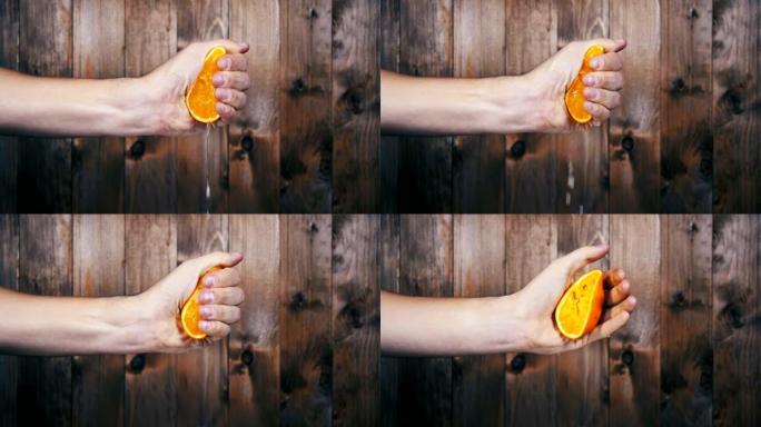 用手从橙子里榨汁。慢动作