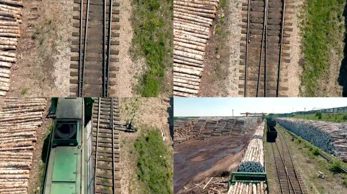 一条铁路和一列有木制原木的火车