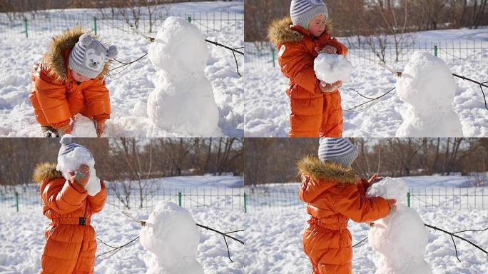 孩子在操场上堆雪人