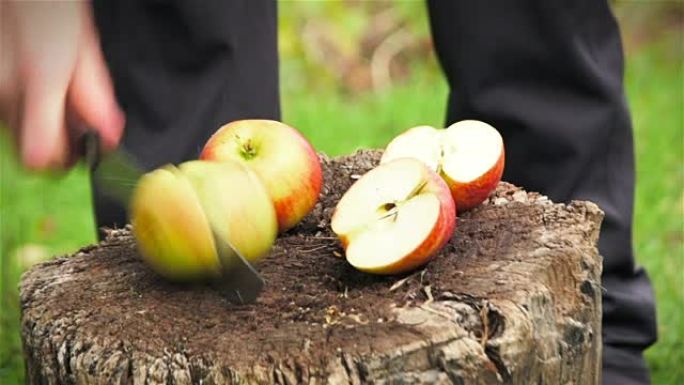 女人用刀切新鲜苹果