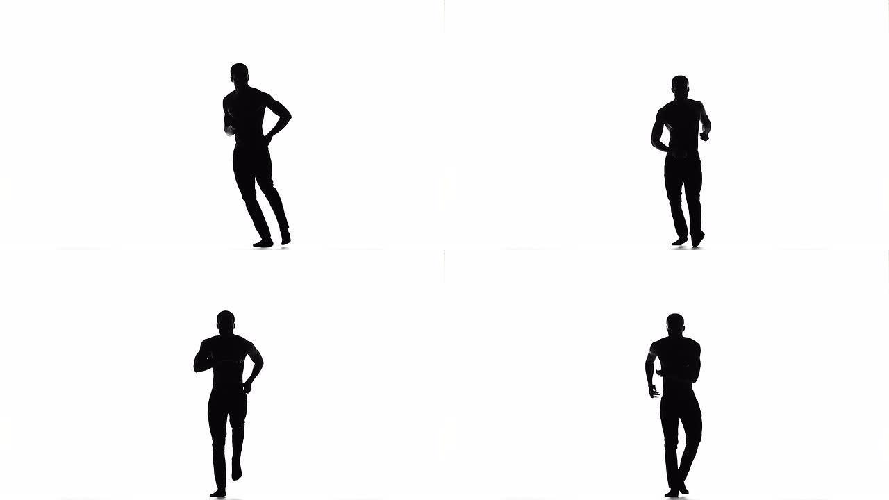 美国黑人男子舞者赤脚在白色上跳拉丁舞，剪影，慢动作
