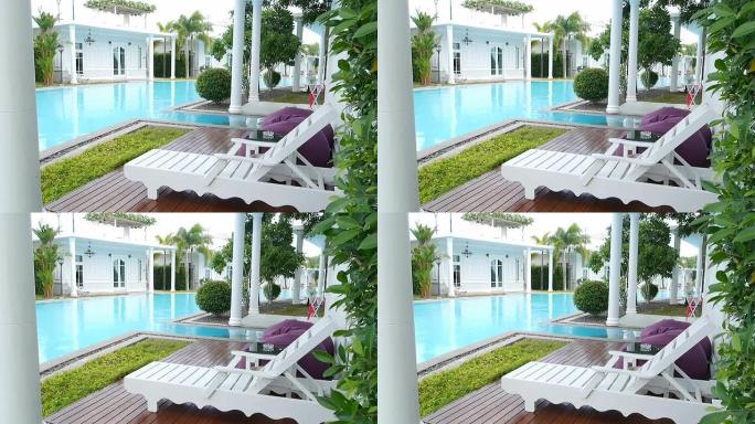 酒店游泳池旁边的放松泳池椅。