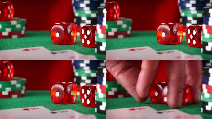 红色骰子按顺序滚动，赌场筹码，绿色毛毡上的卡
