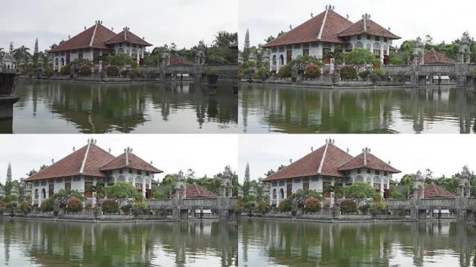 Taman Ujung水上宫，坐落在海洋附近，由印度尼西亚巴厘岛美丽的热带花园装饰