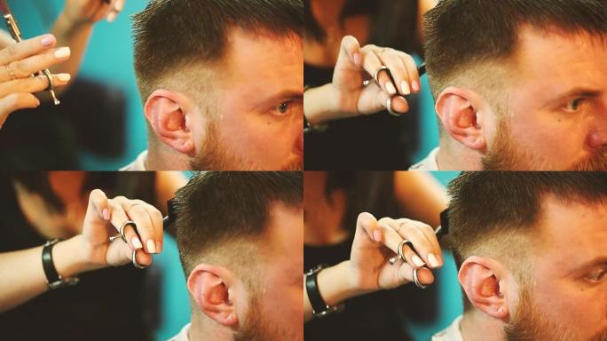 理发师用剪刀剪了一个年轻人