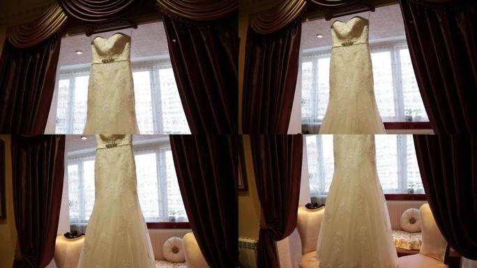 窗户背景上的婚纱