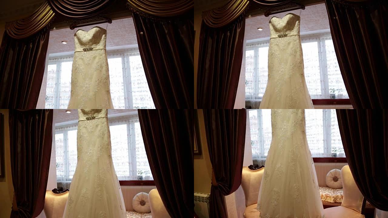 窗户背景上的婚纱