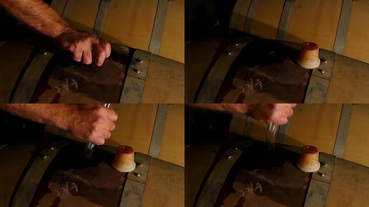 酿酒师在老式酒庄酒窖中测试和品尝红酒