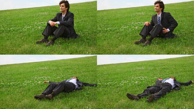 穿着西装的帅哥躺在绿草地上
