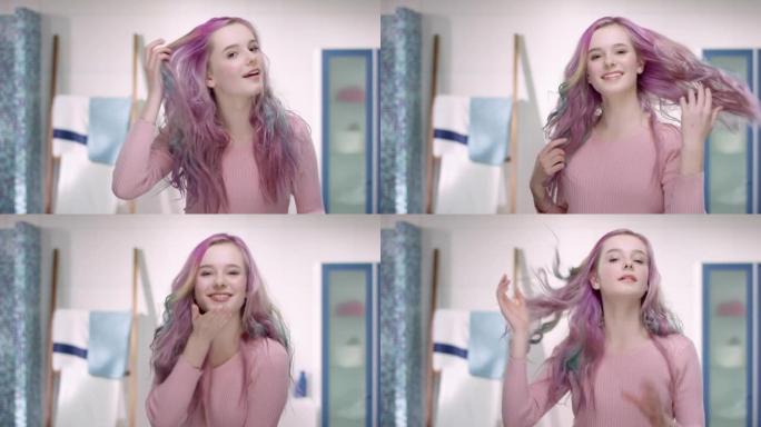 粉红色头发的年轻女孩正在玩镜子和她的头发