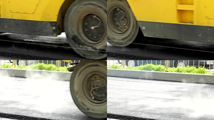 沥青摊铺机在修复后的城市道路上应用沥青。