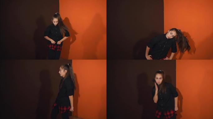 一个成年女孩在原来的工作室里训练嘻哈舞蹈的表演。