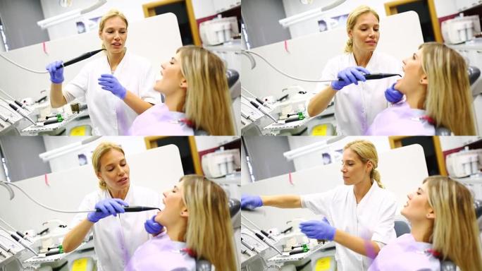 年轻女牙医检查病人