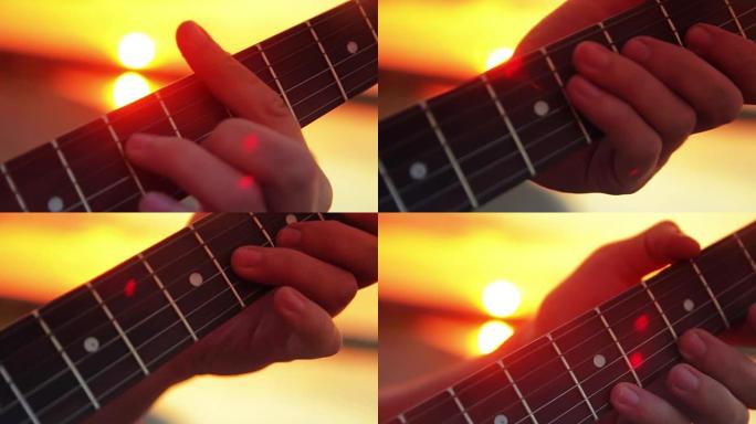男子特写电吉他在日落和夏日傍晚的湖边演奏摇滚