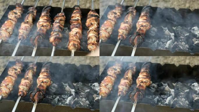 在烤架上的串烧上烹饪猪肉串