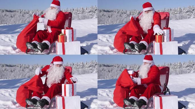 圣诞老人把圣诞礼物放在雪地上的礼品袋里