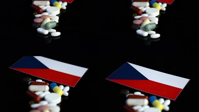 捷克国旗，黑色背景上有许多医用药丸